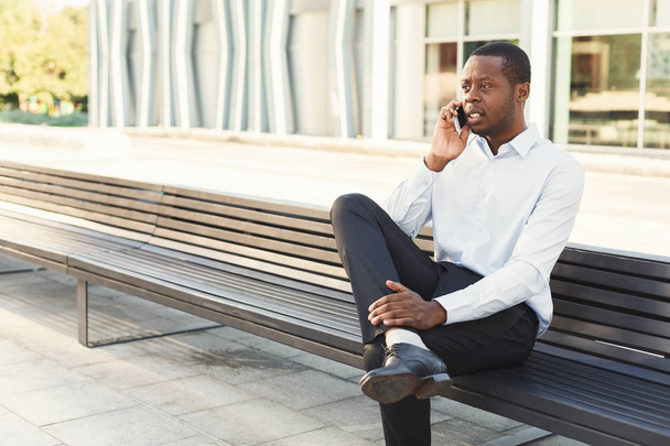 Black businessman outdoors in smart casual ware - Фото, изображение