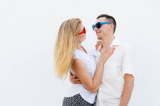 Man and woman wearing heart shape sunglasses - Φωτογραφία, εικόνα