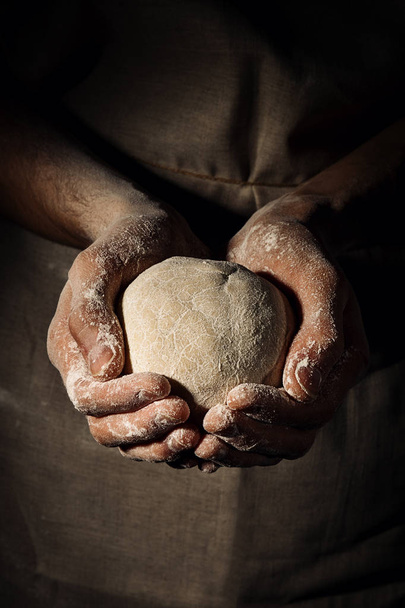Cook holding dough sphere - Фото, изображение