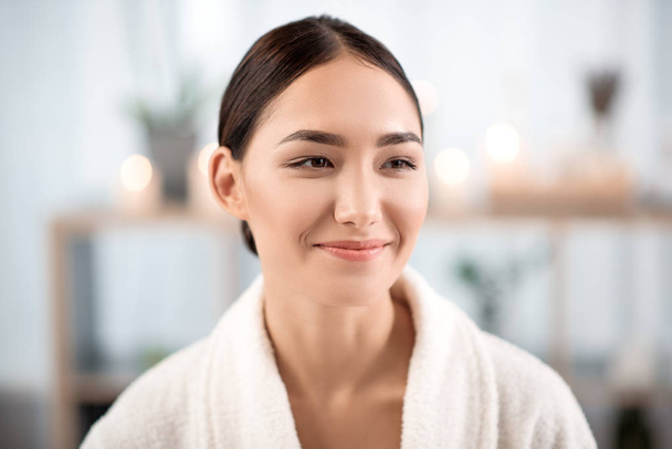 Optimistic elegant woman is relaxing in spa - Photo, image