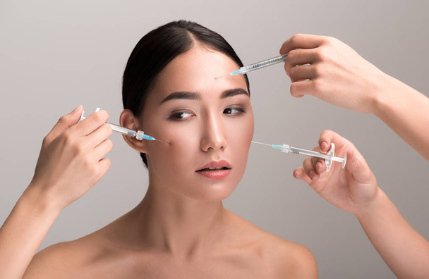 Young woman is having cosmetic procedures of skin rejuvenation - Foto, Imagem