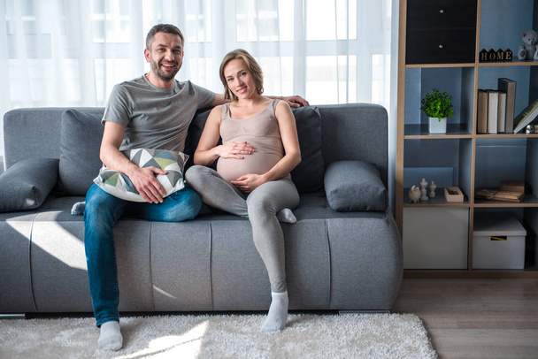 Cheerful husband and wife are waiting for baby - Fotó, kép