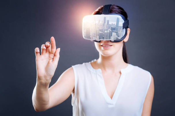 Excited woman looking through virtual mask - Foto, Imagem