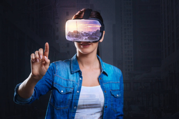 Exuberant glad woman adjusting to virtual reality - Foto, Imagem