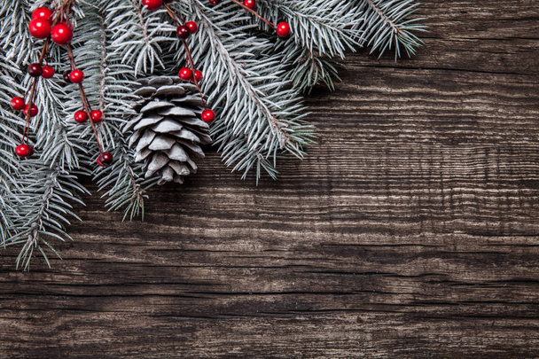 Christmas fir tree with decoration on dark wooden background - 写真・画像