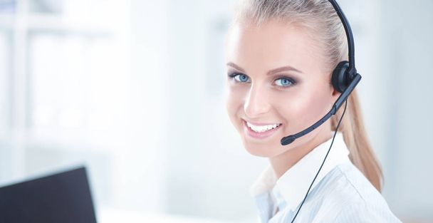 Close-up portrait of a customer service agent sitting at office - Foto, Imagen
