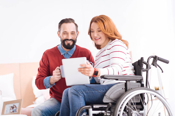 man and crippled woman spending time together - Foto, Bild
