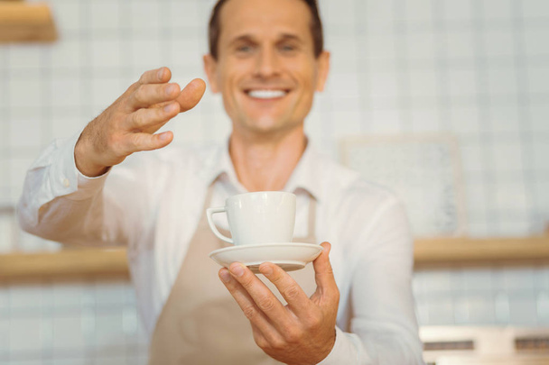 Selective focus of a cup of coffee - Фото, зображення