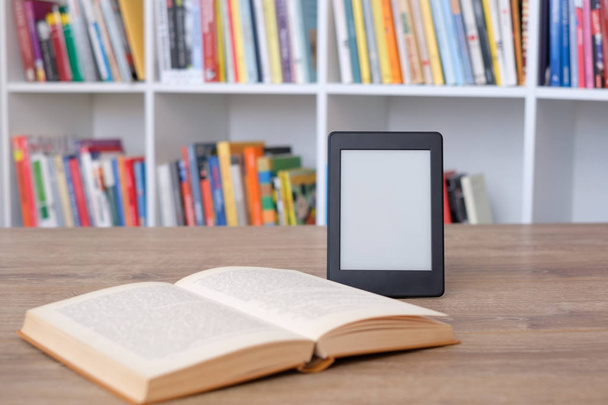 E-book reader on a stack of books - Photo, Image