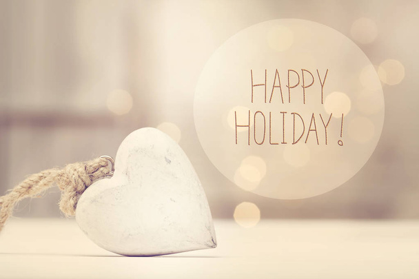 Happy Holiday message with a white heart  - Фото, зображення