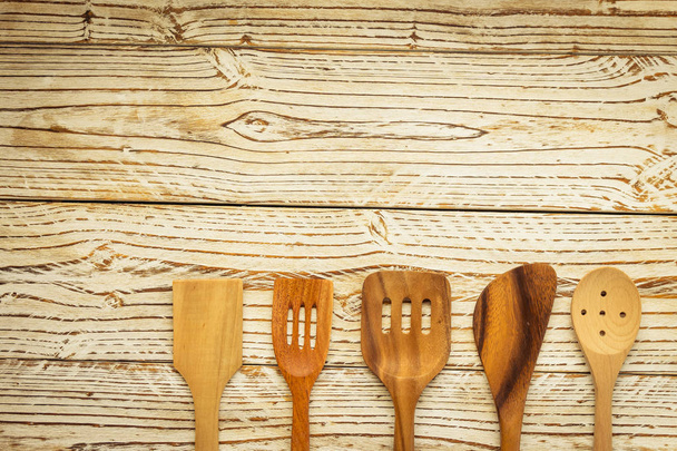 Wood utensils or kitchen ware on wooden table with copy space - Vintage Filter - Photo, Image