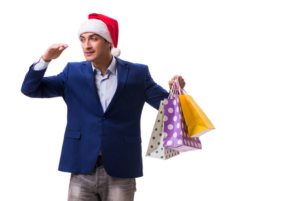 Young man with bags after christmas shopping on white background - Photo, Image