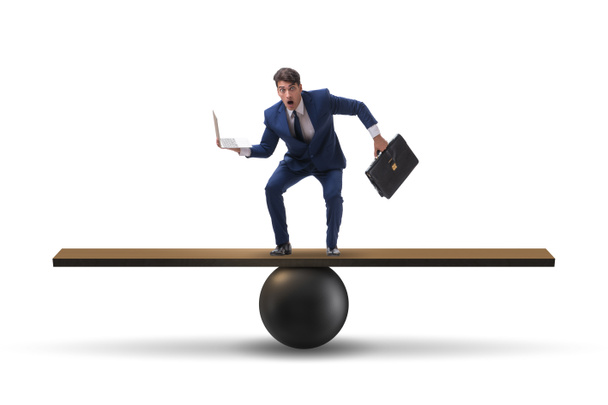 Businessman balancing on seesaw in uncertainty concept - Photo, Image