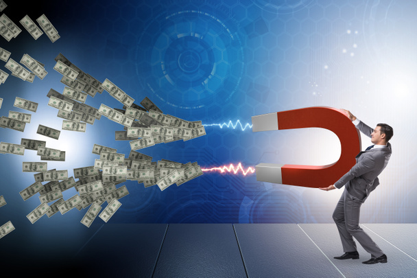 Бизнесмен ловит доллары на подковообразном магните - Фото, изображение