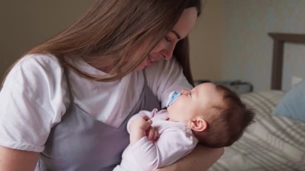 Happy mother caresses her baby - Felvétel, videó