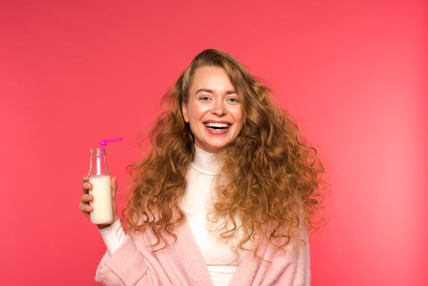 happy woman holding milkshake isolated on red - Photo, Image