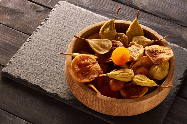 Dried fruits on slate plate  - Foto, Bild