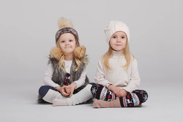 two beautiful girls on white background - Foto, afbeelding