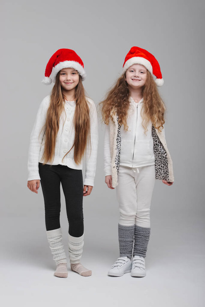 cute happy children with santa hats - Photo, Image