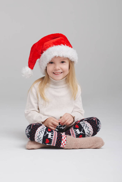 little happy girl with santa hat - Фото, изображение