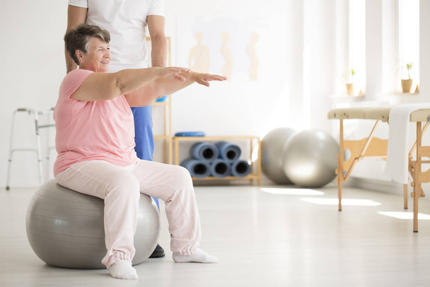 Senior woman maintaining balance - Фото, зображення
