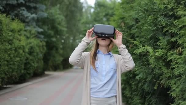 Young woman watching video by virtual reality headset. - Footage, Video