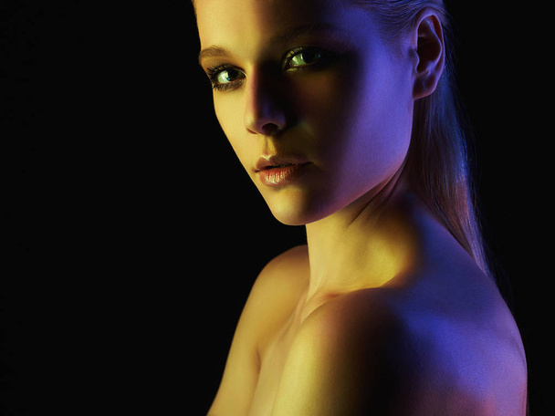 Fashion young woman in colorful lights - Foto, Bild