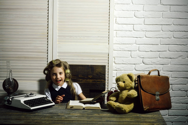 Child with briefcase and alarm clock. - Photo, Image