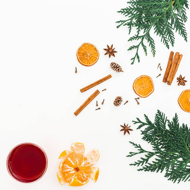 Christmas hot mulled wine with cinnamonon white background. Flat lay, top view - Photo, Image