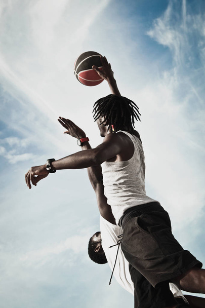 Two men playing basketball  - Фото, изображение