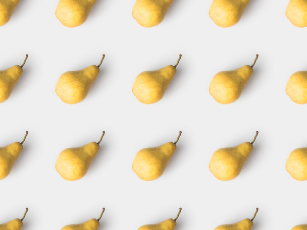 repetitive pattern of yellow pears isolated on white - Photo, Image