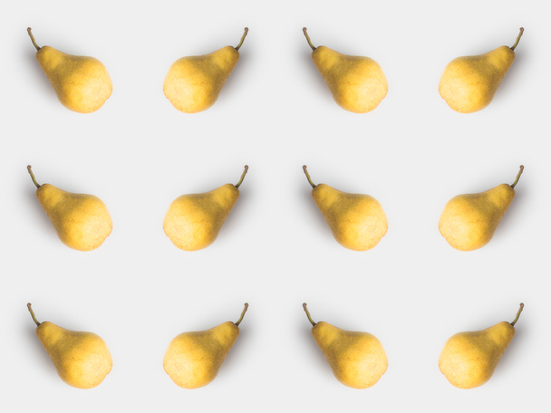 pattern of fresh yellow pears isolated on white - Foto, imagen