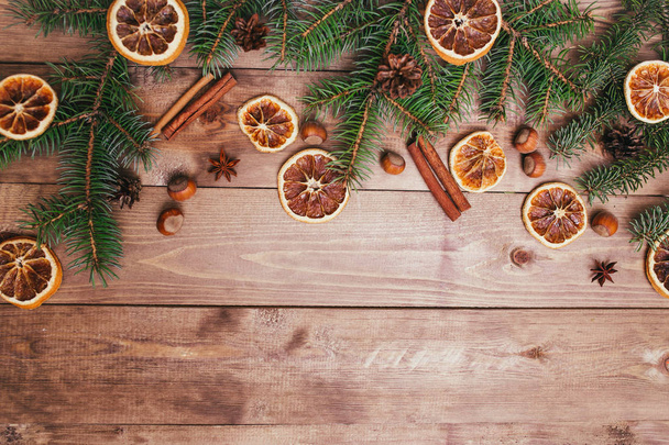 Christmas or New Year brown wooden background, Christmas food decor with fir tree.Xmas decorations, space for a text, view from above - Φωτογραφία, εικόνα