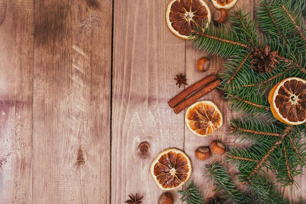 Christmas or New Year brown wooden background, Christmas food decor with fir tree.Xmas decorations, space for a text, view from above - Φωτογραφία, εικόνα