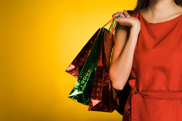girl in red dress after shopping and black Friday - Foto, afbeelding
