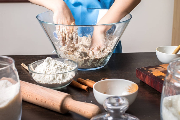 Little girl kneading dough for cookies - Photo, image