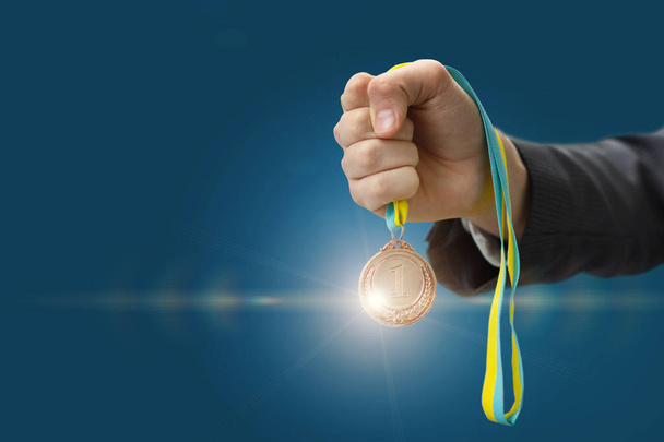 Medal in hand businessman . - Photo, Image