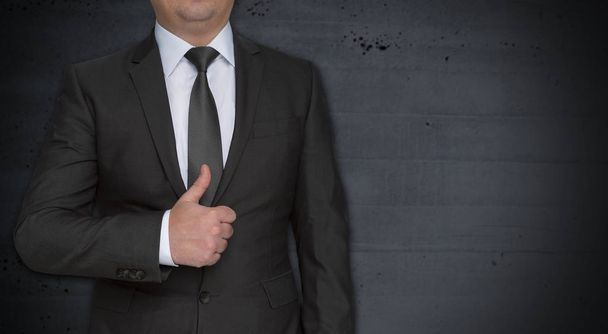 Businessman with thumbs up and copyspace - Photo, image