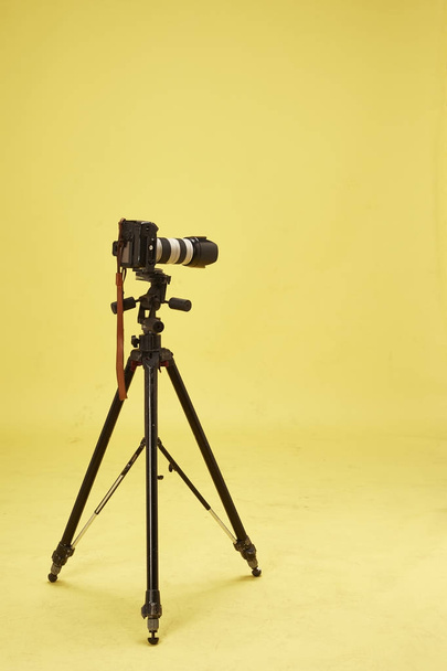 modern professional camera on tripod on white background - Photo, Image