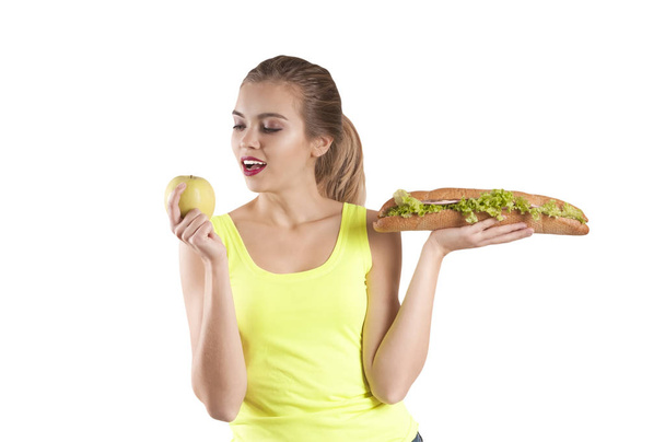 beautiful sports girl sandwich and apple - Photo, Image