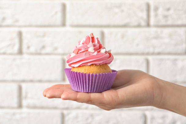Woman holding delicious cupcake  - Photo, Image