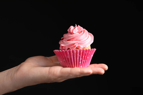 Woman holding delicious cupcake  - 写真・画像