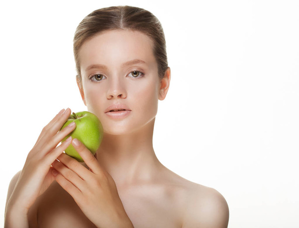 Young  woman with green apple, isolated on white background - Φωτογραφία, εικόνα