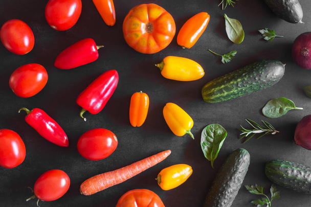 Fresh organic vegetables on a dark background. Top view - Photo, image