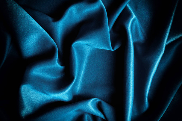 Koostumus, tausta. malli. Silkki kangas sininen, sininen silkki verho
 - Valokuva, kuva