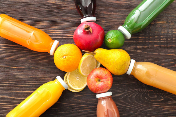 Composition with bottles of fruit juices - 写真・画像