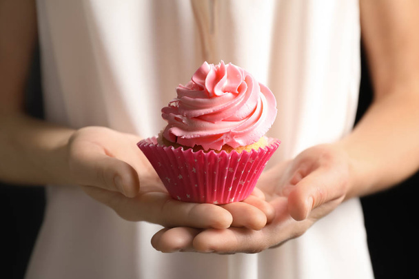 Woman holding delicious cupcake - Фото, изображение