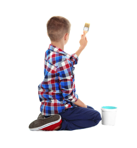 Cute little boy with brush painting against white background - Photo, Image