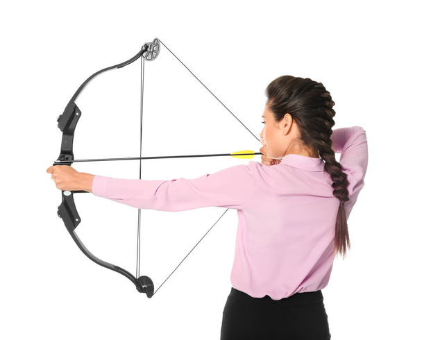 woman in formal clothes practicing archery - Фото, зображення