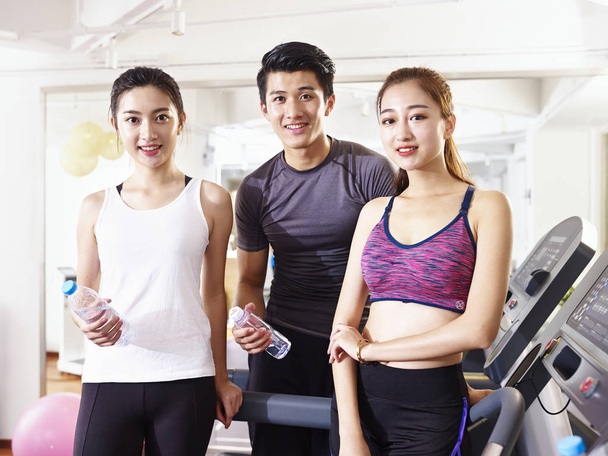 portrait of three young asian people in gym - Photo, Image